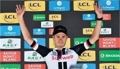  ?? GETTY IMAGES ?? Phil Bauhaus celebrates on the podium after winning the fifth stage of the Criterium du Dauphine