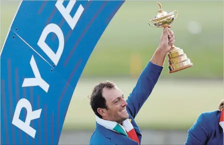  ?? ALASTAIR GRANT THE ASSOCIATED PRESS ?? Europe’s Francesco Molinari hoists the spoils after his team won the Ryder Cup at Le Golf National in Saint-Quentin-en-Yvelines, outside Paris.