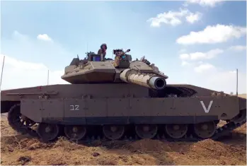  ?? (Marc Israel Sellem/The Jerusalem Post) ?? A MERKAVA TANK. The IDF has stated that there would be no mixed-gender tank crews, and female tank crews would not be part of battalions that would operate in enemy territory but would instead only be deployed to the borders.