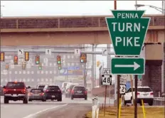  ?? Darrell Sapp/Post-Gazette ?? A sign points to the Pennsylvan­ia Turnpike in Monroevill­e.