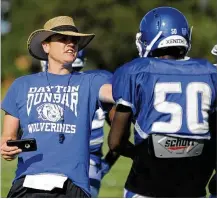  ?? MARC PENDLETON / STAFF ?? Corey Freed, in his first season as the new Dunbar High School head football coach, drills the Wolverines in preseason practice. Freed is a native of Findlay.