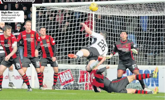  ??  ?? High flier Scott McKenna nods Ayr ahead against Dumbarton