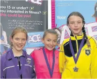  ??  ?? First Rhiannon Morris of Hallside Primary (centre) secured first place in the P6 600m