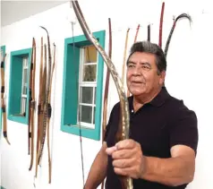  ??  ?? bottom leftJoe Hernandez speaks about a bow he made of old sage during an interview Oct. 24 at his workshop.
