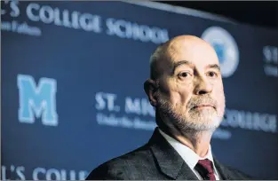  ?? CP PHOTO ?? St. Michael’s College School principal Gregory Reeves speaks to reporters at the school in Toronto Monday.