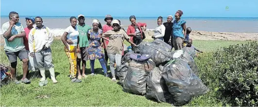  ?? Pictures SUPPLIED ?? CLEAN UP: Over hundred villagers on the Amadiba coast in Mbizana have picked piles of garbage on the Wild Coast during the past ten days. Hundreds of bags have been filled with plastic, bottles and filth on the shores.