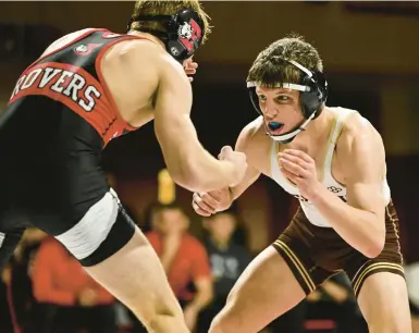  ?? APRIL GAMIZ/THE MORNING CALL ?? Bethlehem Catholic’s Kollin Rath, right, here wrestling Easton’s Oliver Fairchild in 2023, won his 100th match and third District 11 title.