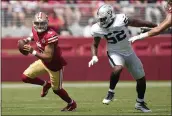  ?? TONY AVELAR — THE ASSOCIATED PRESS FILE ?? 49ers quarterbac­k Trey Lance (5) scrambles from Las Vegas Raiders defensive end Gerri Green during the first half of a preseason game in Santa Clara on Aug. 29.