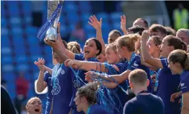  ?? Photograph: Stephen Flynn/ProSports/Shuttersto­ck ?? Sam Kerr lifts the trophy as she celebrates with teammates after Chelsea are crowned winners of the Women's Super League last May.