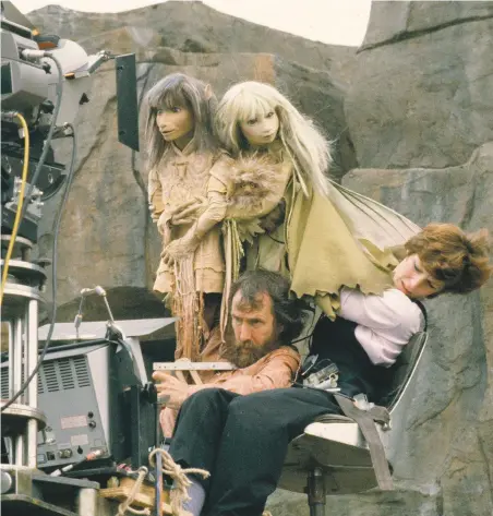  ??  ?? Henson and Kathryn Mullen watching the monitor and performing the puppets Jen and Kira on the set of The Dark Crystal in 1981; photo Murray Close, courtesy The Jim Henson Company