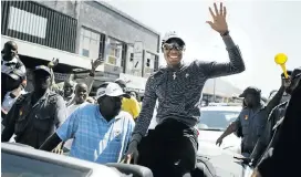  ?? Pictures: City Press/Gallo Images/Getty Images and Elijar Mushiana ?? Caster Semenya , above, waves to the crowd during a street parade in Polokwane, and visits her home village of Ga-Masehlong, right, on August 30 2009 after winning gold in the women’s 800m at the World Championsh­ips in Berlin with a time of 1:55.45.