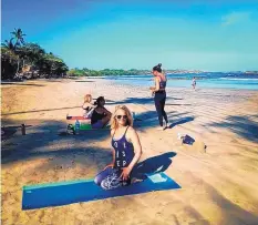  ??  ?? Vicki Garay sits on a beach in Costa Rica during a visit in May. She traveled there with her mother for a yoga retreat hosted by local studio Blissful Spirits.