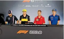  ?? GETTY IMAGES ?? Brendon Hartley, right, sits next to Sebastian Vettel at an F1 press conference.