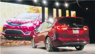  ?? TONY DING, THE ASSOCIATED PRESS ?? the 2017 Chrysler Pacifica minivan is unveiled at the North American Internatio­nal Auto Show in Detroit on Monday. The Pacifica is Chrysler’s first new minivan in eight years.