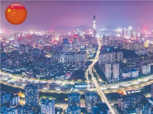  ??  ?? BRIGHT LIGHTS: The Shenzhen skyline at night shows a vibrant and modern city with its population of 12 million.