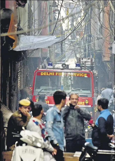  ?? ANI ?? Firefighte­rs started the rescue operations at 5.25am on Sunday. At least 30 fire tenders, more than 150 men and 1.5 lakh litres of water was used in the operation, director of Delhi Fire Services Atul Garg said.