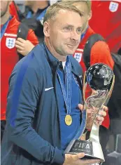  ??  ?? Paul Simpson with the World Cup.