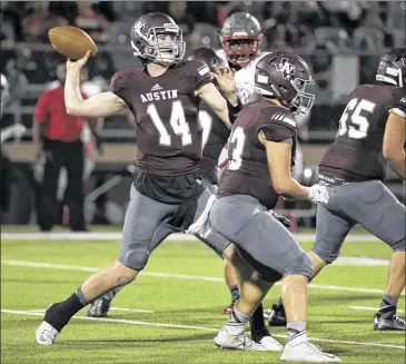  ?? PHOTOS BY RALPH BARRERA/ AMERICAN-STATESMAN ?? Quarterbac­k Beau Kalbacher looks for a receiver during Austin High’s 39-7 victory over Del Valle in a district game at House Park. The Maroons scored on each of their four first-half possession­s.