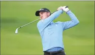  ?? Yong Teck Lim / Getty Images ?? Justin Thomas hits his second shot on the second hole during the third round of the Genesis Open on Saturday.