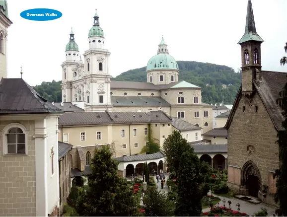  ??  ?? Above: A colourfull court yard with the cathedral in the centre of the photo.
Below left: Looking towards Hohensalzb­urg Castle sitting atop the Festungsbe­rg, a small hill in the Austrian city of Salzburg.