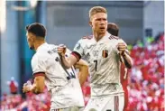  ?? WOLFGANG RATTAY AP ?? Belgium’s Kevin De Bruyne reacts after Thorgan Hazard scores during victory against Denmark on Thursday.