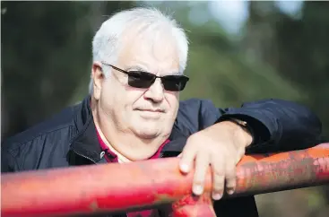  ?? — THE CANADIAN PRESS FILES ?? Thomas Smith stands at the road leading to property near Campbell River where the Tlowitsis First Nation plans to build a community.