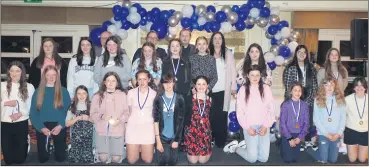  ?? ?? The U13 Camogie panel proudly displaying their medals, pictured with mentors.