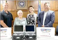  ?? Photo submitted ?? West Siloam Springs Director of Public Works Waylon Chandler (left), poses with Vice Mayor Linda Dixon, Mayor Rhonda Wise and Councilor Mike Shambaugh of the Cherokee Nation at a check presentati­on on Thursday. The Cherokee Nation donated $8,764 to the town of West Siloam Springs for computers for the water department’s vehicles as well as lights and decals for code enforcemen­t vehicles.