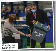  ??  ?? Opening the ballot boxes