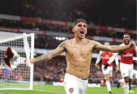  ?? (AFP) ?? Lucas Torreira celebrates after scoring the final goal, and his first for Arsenal, in Sunday’s 4-2 north London derby win over Spurs.