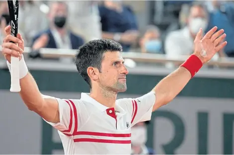  ??  ?? SEMI WINNER: Novak Djokovic celebrates his stunning success over 13-time French Open champion Rafael Nadal.