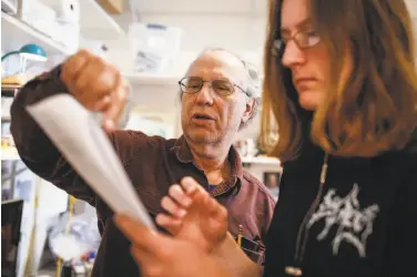  ?? Amy Osborne / Special to The Chronicle ?? Lowell High School teacher Richard Shapiro goes over a physics final exam with student Calum Lacy.