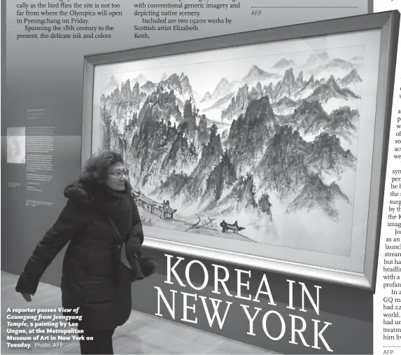  ?? Photo: AFP ?? A reporter passes View of Geumgang from Jeongyang Temple, a painting by Lee Ungno, at the Metropolit­an Museum of Art in New York on Tuesday.