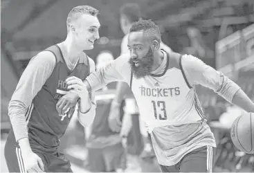  ?? Yi-Chin Lee / Houston Chronicle ?? Forward Sam Dekker, left, and James Harden enjoy a light moment at practice at Toyota Center on Friday. Dekker, who missed four weeks with a fractured left hand, says he’ll be available to play against the Spurs.