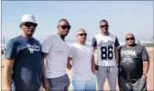  ??  ?? METAL HEADS: Joburg road trippers who come down to Durban every year for the July and a jol are, from left: Eddie Malande, 40, Elton Mcrowdie, 30, Kurt Moodley, 24, Alroy Fernandez, 33, and Virgil Williams, 39.
