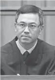  ?? GEORGE F. LEE, AP ?? U. S. District Judge Derrick Watson blocked President Trump's revised travel ban on March 15, hours before it was to take effect.