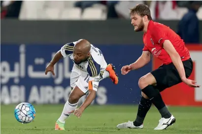  ?? AFP file ?? Al Wahda’s captain Ismail Matar (left) is tackled by Al Rayyan’s Nathan Otavio Ribeiro during the Asian Champions League playoff match at the Jassim bin Hamad Stadium in Doha. Al Wahda lost the match 2-1. —