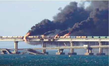  ?? GETTY-AFP ?? Smoke billows from the Kerch Bridge linking Crimea and Russia after an explosion Saturday that killed three people.