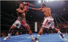  ?? Tim Warner / Getty Images ?? Jermall Charlo connects with a jab against Brandon Adams during Saturday night’s World Boxing Council middleweig­ht title fight at NRG Arena. Charlo won by unanimous decision.