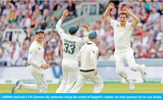  ??  ?? LONDON: Australia’s Pat Cummins (R) celebrates taking the wicket of England’s captain Joe Root (unseen) for no runs during play on the fourth day of the second Ashes cricket Test match between England and Australia at Lord’s Cricket Ground in London yesterday. — AFP