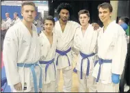  ??  ?? Top, David Williams (second from left) and David Coope (centre back with trophy) along with members of the Bath and Coventry teams. Bottom, David Coope, left, an instructor with the Simon Coope Karate School.