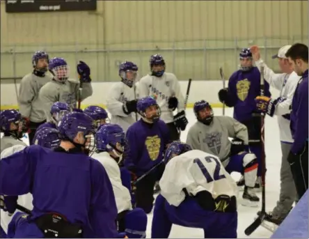  ?? BY JOE BOYLE JBOYLE@DIGITALFIR­STMEDIA.COM @BOYLERALER­TTROY ON TWITTER ?? The Christian Brothers Hockey Team listens to coach Blaine Drescher go through the next drill in practice on November 19 at the Albany County Hockey Facility.