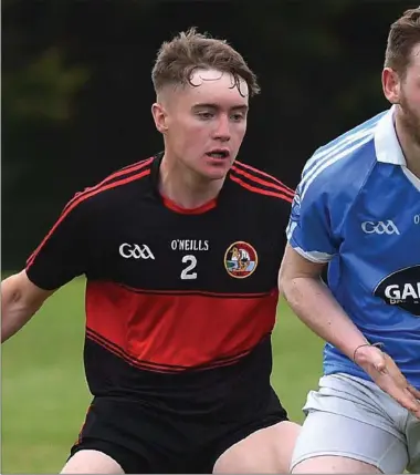  ??  ?? Newtown Blues’ Conor Moore is tracked by Dreadnots’ Aaron Scully. Picture: Colin Bell