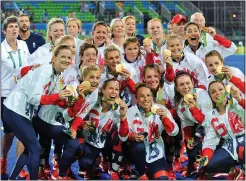  ??  ?? GIRL POWER: Team GB’s triumphant players show off their medals