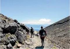  ?? TOM LEE/STUFF ?? Walking the Tongariro Crossing.