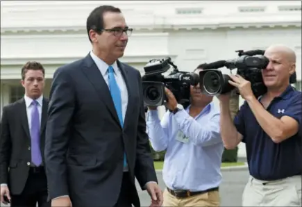  ?? SUSAN WALSH - THE ASSOCIATED PRESS ?? Treasury Secretary Steven Mnuchin walks out to speak with reporters at the White House in Washington, Wednesday.