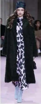  ??  ?? LONG statement coat.