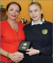  ??  ?? Above: Sarah McAuliffe receiving the Maths and Athletics Award from her teacher, Moira O’Connor.