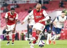  ??  ?? Alexandre Lacazette scored Arsenal’s winning goal against Tottenham from the penalty sport