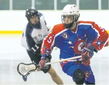  ??  ?? Sam LeClair of the Welland Generals races the ball up the rink during their game against the Niagara Thunderhaw­ks in jr B lacrosse action at the Virgil Arena in Virgil on Tuesday,.